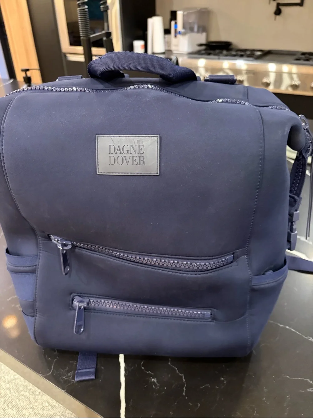 Dagne Dover Navy Neoprene Backpack with Front Zip Pockets